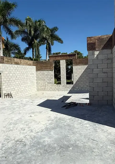 Concrete block walls with window openings and tie beam forms