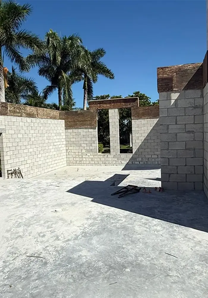 Concrete block walls with window openings and tie beam forms