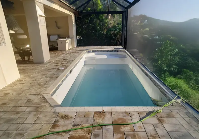 Paver pool deck under a screen enclosure in Southwest Florida