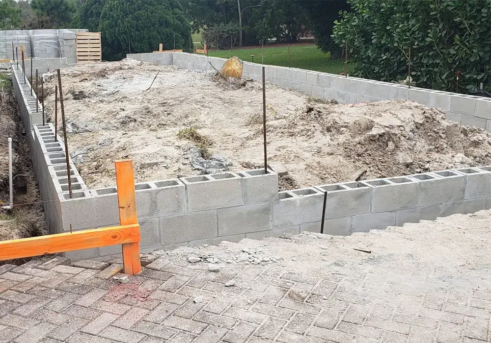 Block stem wall perimeter set on footings before fill